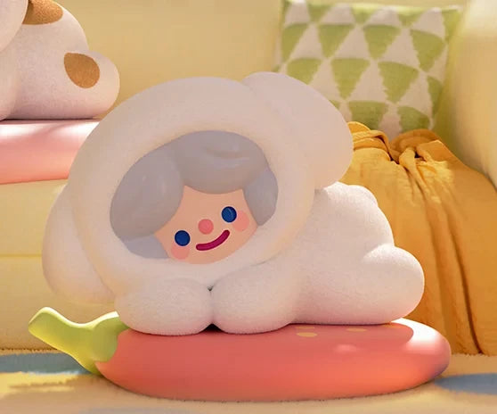 Plush toy shaped like a cloud with a face on a colorful couch