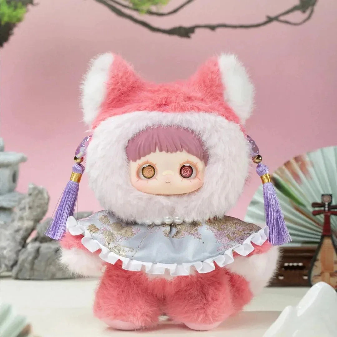 Plush toy with pink and white fur, wearing a hat and dress, on a blurred background.