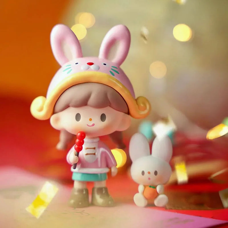 Toy figure of a girl with bunny ears and a small rabbit in front of colorful lights