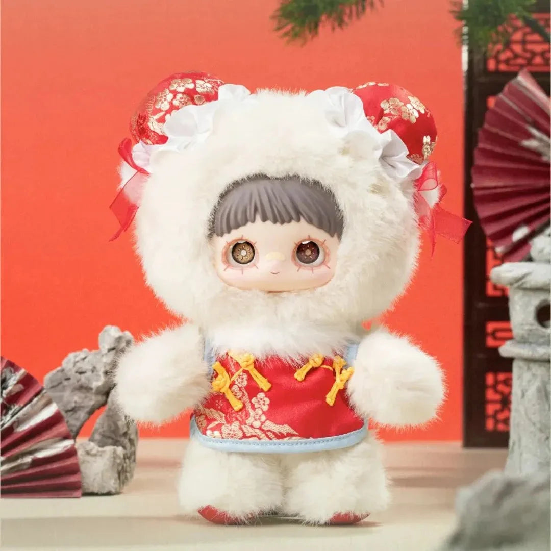 Plush toy with a white fur coat and red outfit against a red background