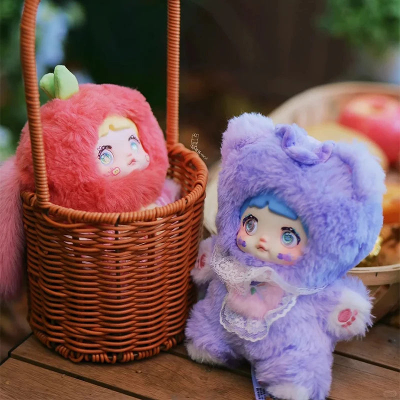 Plush toy in a basket with another plush toy on a wooden surface