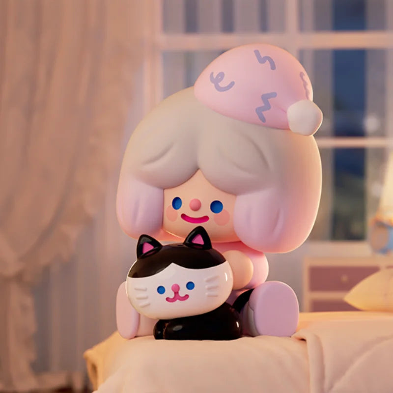 Cute character figurine with a cat design on a soft surface