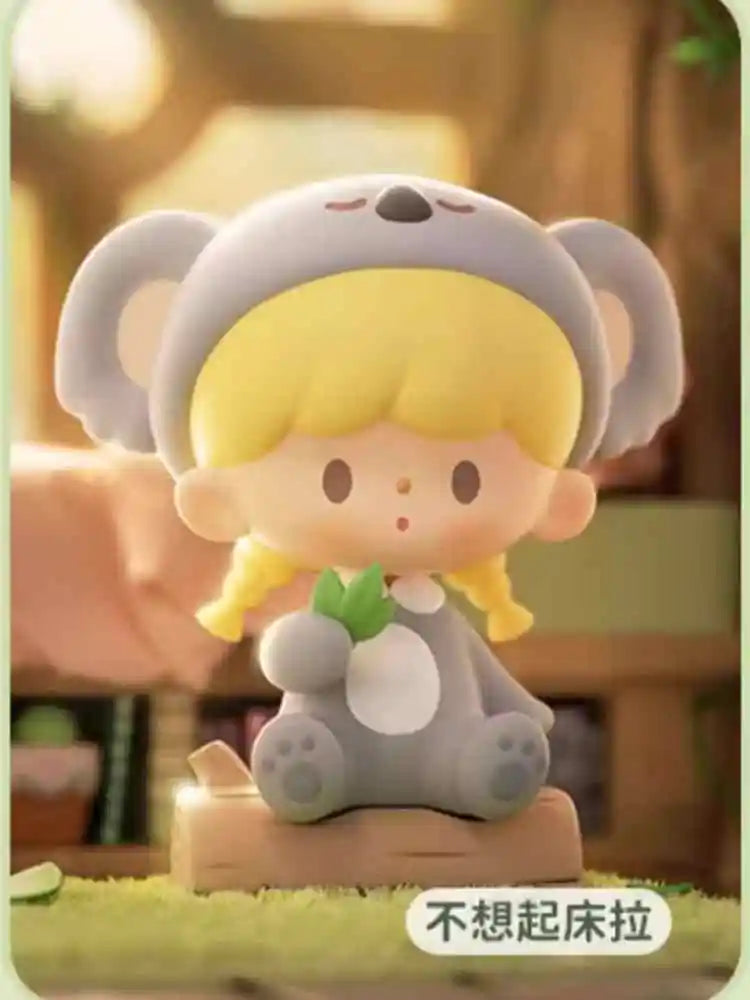 Cartoon figurine with animal ears and a blurred background