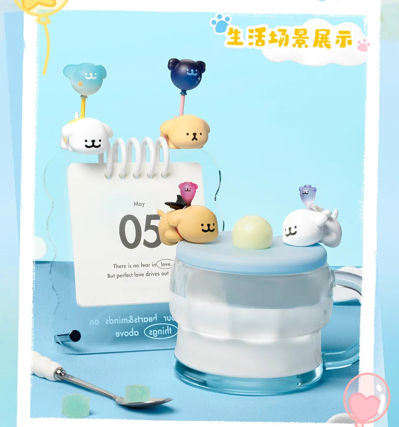 Cute cartoon character accessories on a glass container with a blue background