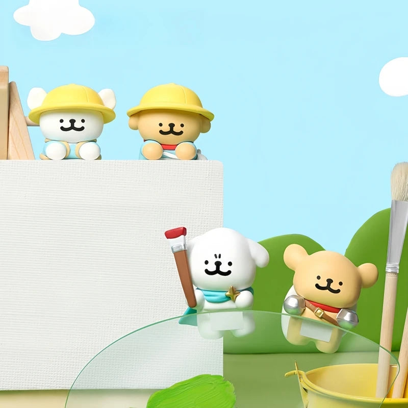 Toy figures of animals in a painting-themed setting with a blue sky and white clouds.