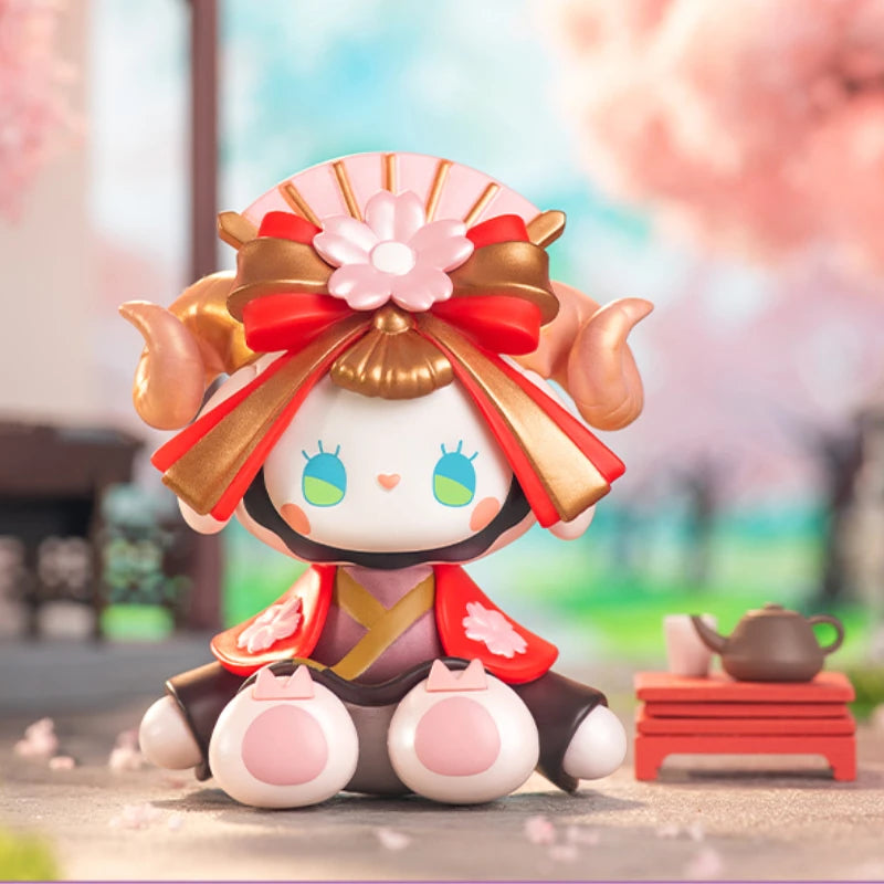 Toy figure with traditional Japanese attire in a blurred outdoor setting