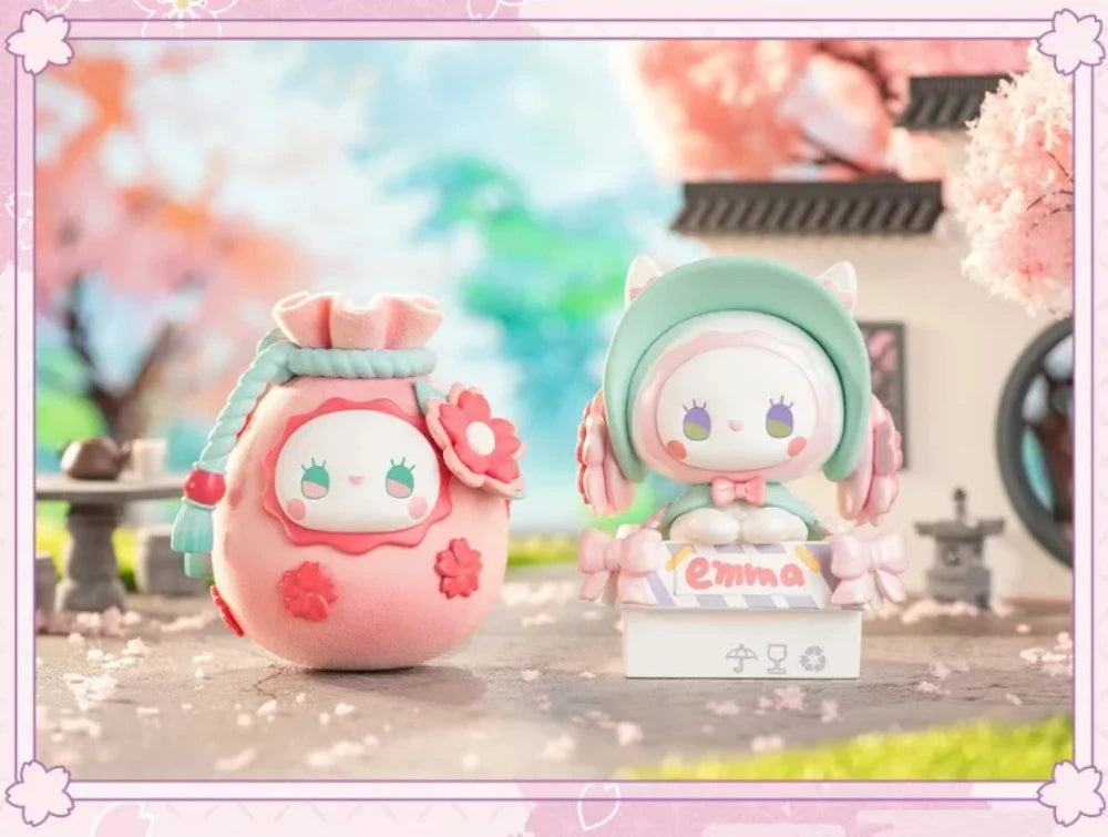 Two cute plush toys with cherry blossom background