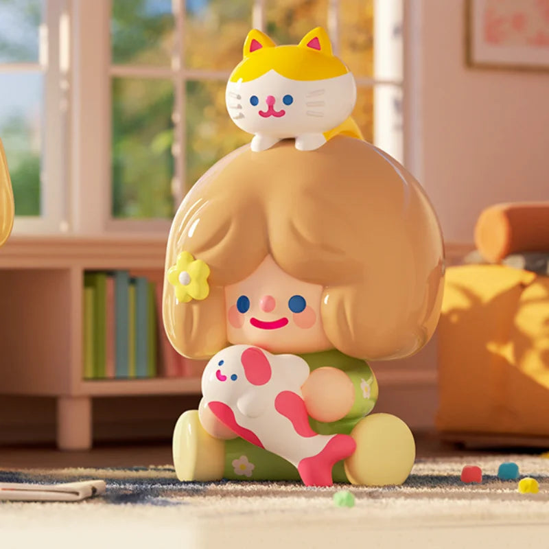 Colorful toy figure of a girl with a cat on her head in a room setting