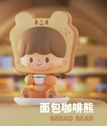 Toy figure of a bear with bread-shaped head in a blurred indoor setting
