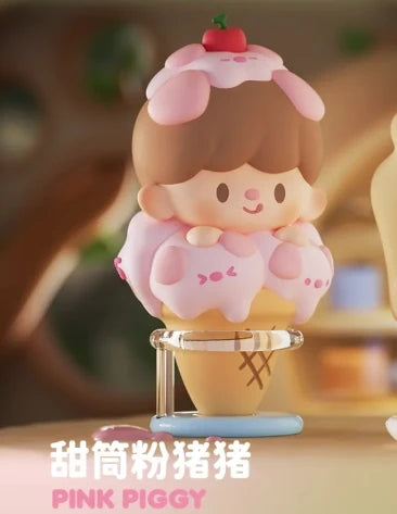 Pink piggy figurine on an ice cream cone with a blurred background