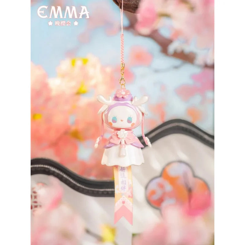 Animated character charm with cherry blossoms in the background, featuring the brand 'EMMA'.