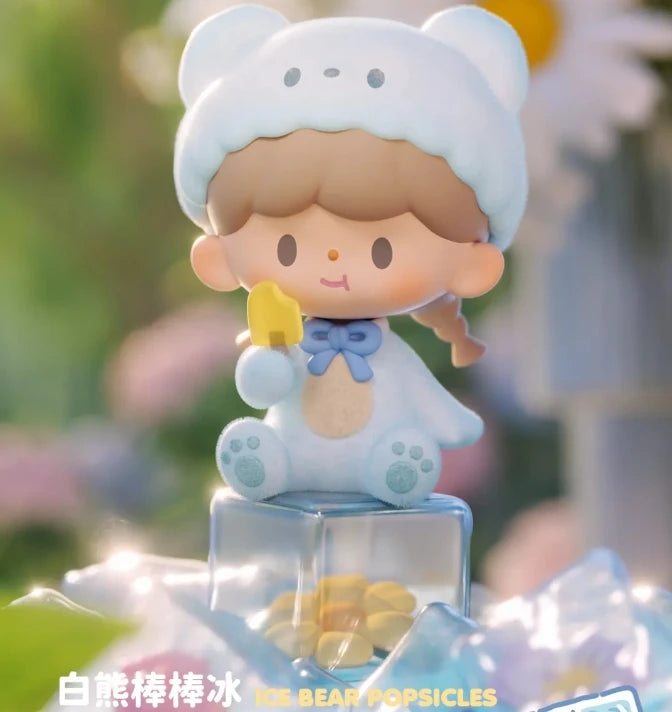 Cute figurine of a bear holding a popsicle with a blurred background