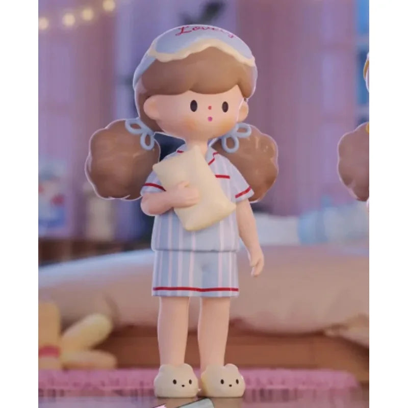 Toy figure of a nurse holding a baby in a soft focus background