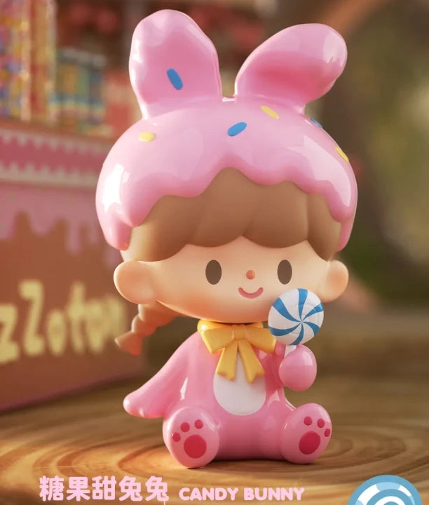 Toy figure of a girl with bunny ears and pink outfit on a wooden surface