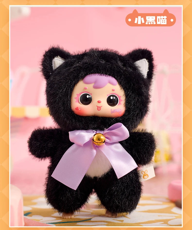 Plush toy in a black cat costume with a pink bow on a pink background
