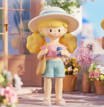 Toy figure of a girl with a hat and sunglasses in a garden setting