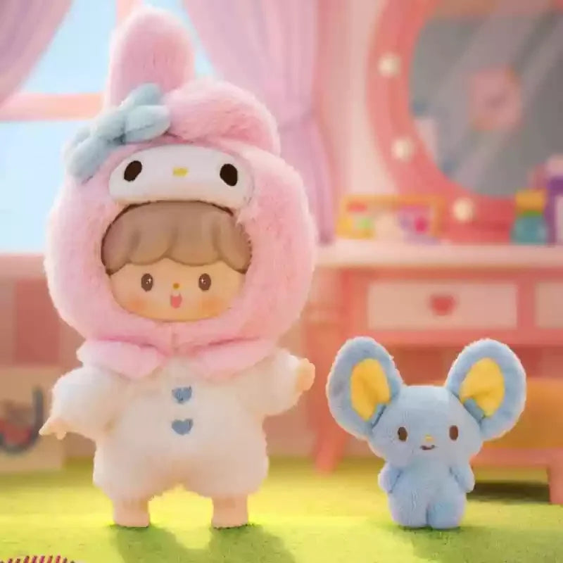 Plush toy in a pink bunny costume with a small blue plush toy in a room with pink walls and toys.