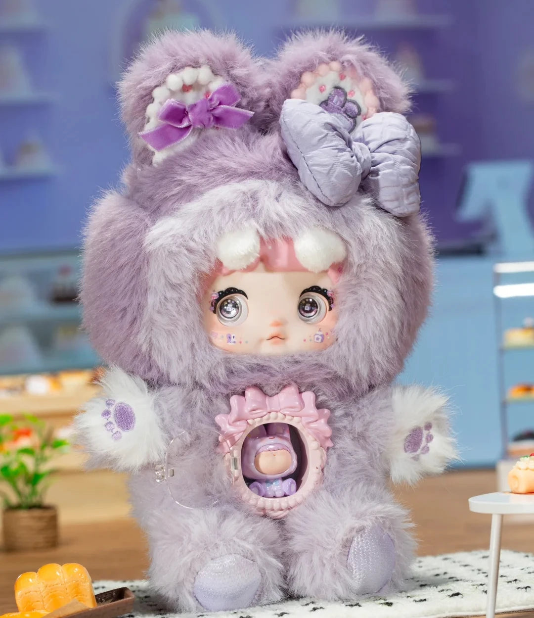 Cute plush toy with fluffy purple hair and bow accessories on a blurred indoor background