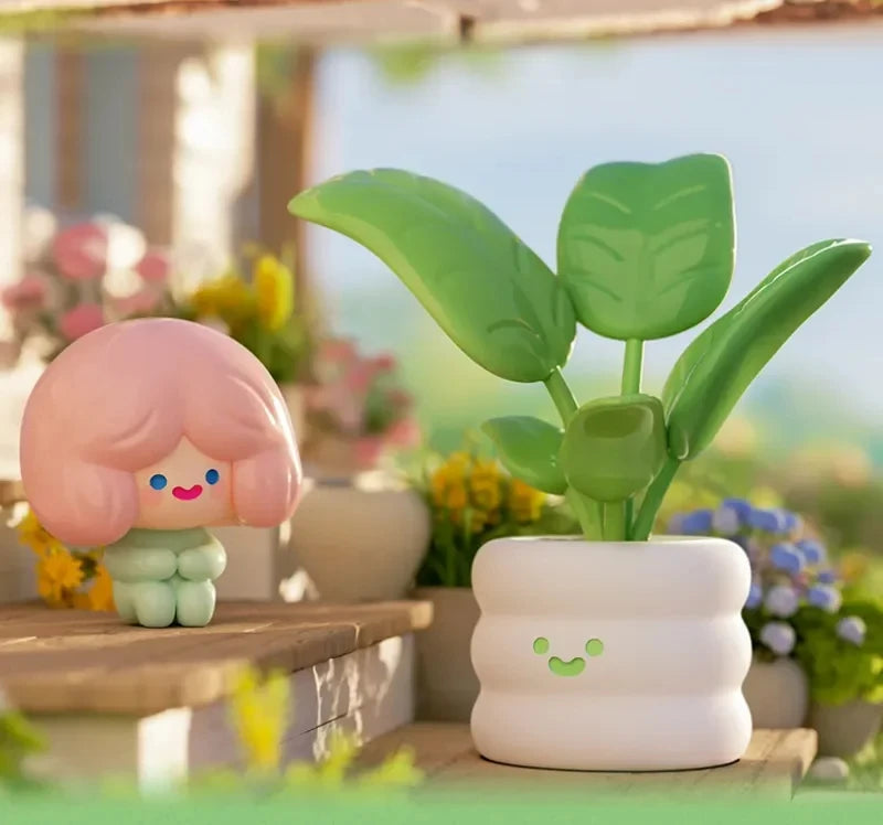 Two cute, cartoon-like plant-shaped objects with a blurred garden background