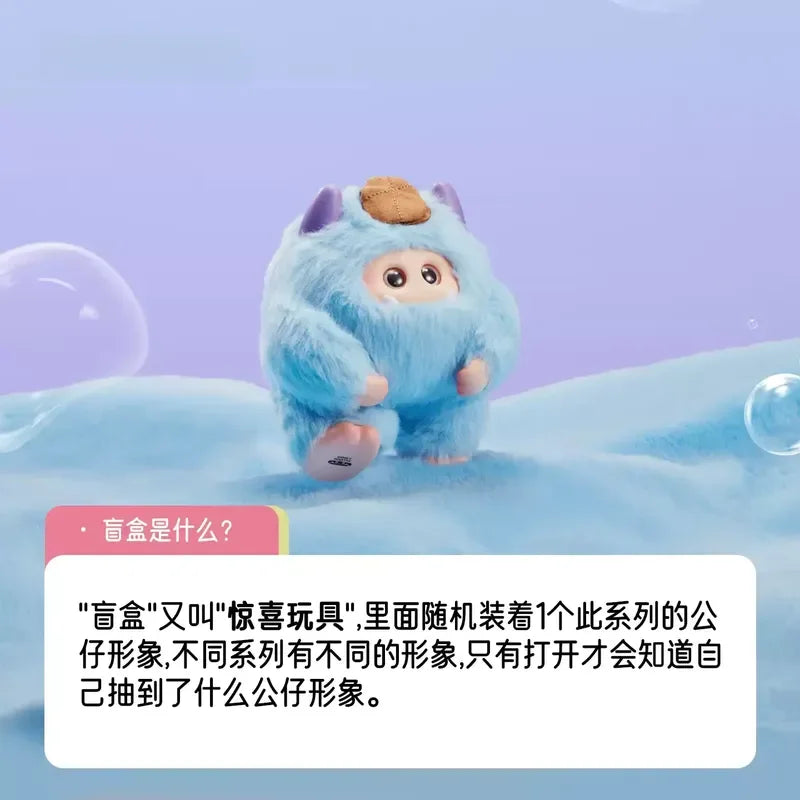Blue plush toy with a purple hat on a blue and pink background