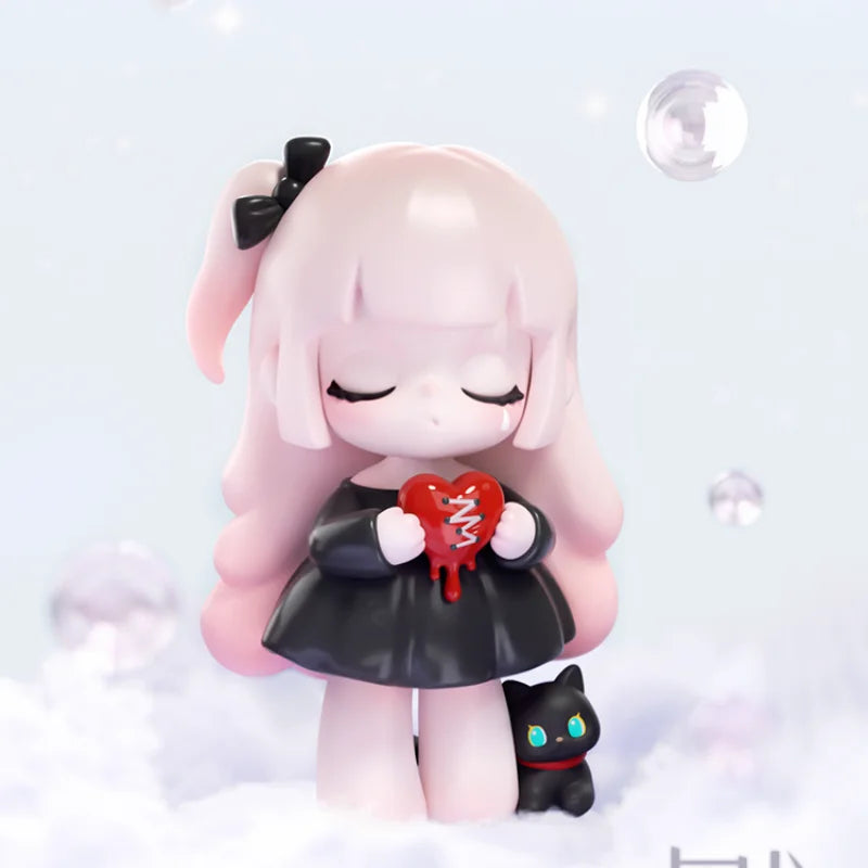 Pink-haired figurine holding a red heart with a black cat on a light gray background