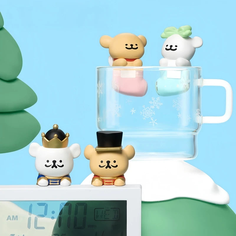 Four small animal figurines with hats around a clear glass mug on a blue background