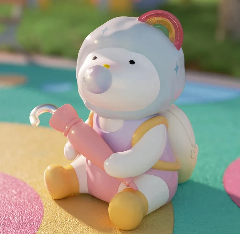 Cute cartoon character toy with a rainbow on a colorful background