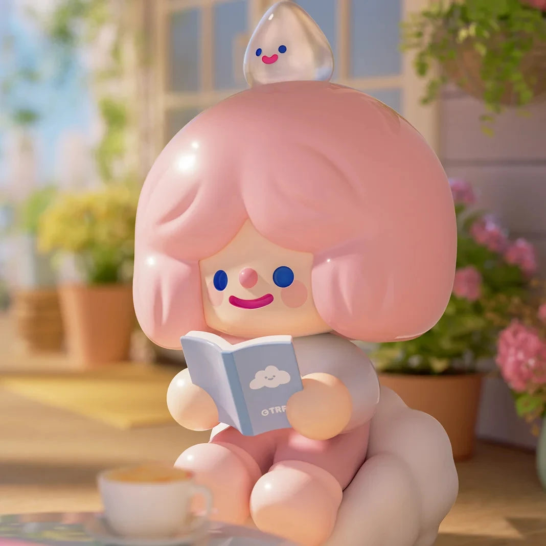 Cute character figurine with pink hair reading a book in a blurred indoor setting