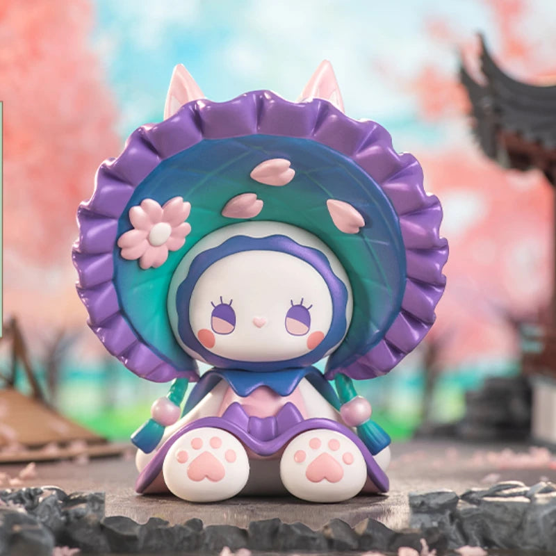 Cute figurine with a large purple hat featuring floral designs on a colorful background