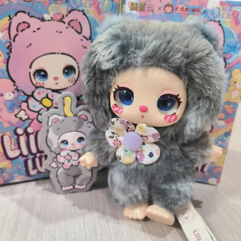 Small doll with gray fur outfit and colorful buttons, standing in front of a colorful background with cartoon characters.