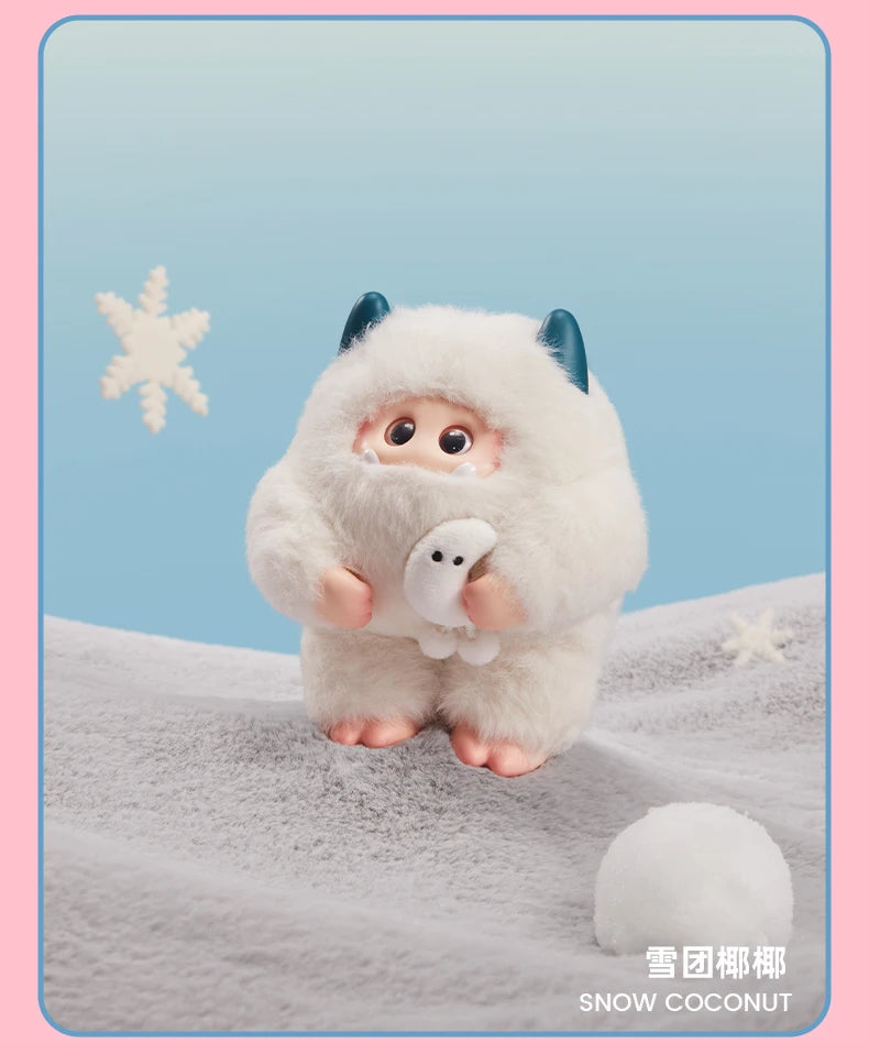 Plush toy resembling a snow creature with a blue horn on a light blue background, featuring the brand 'Snow Coconut'.
