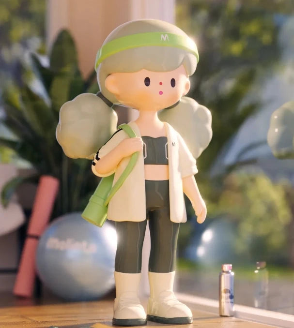 Figurine of a person in athletic wear with a green headband and bag, standing indoors with plants in the background.