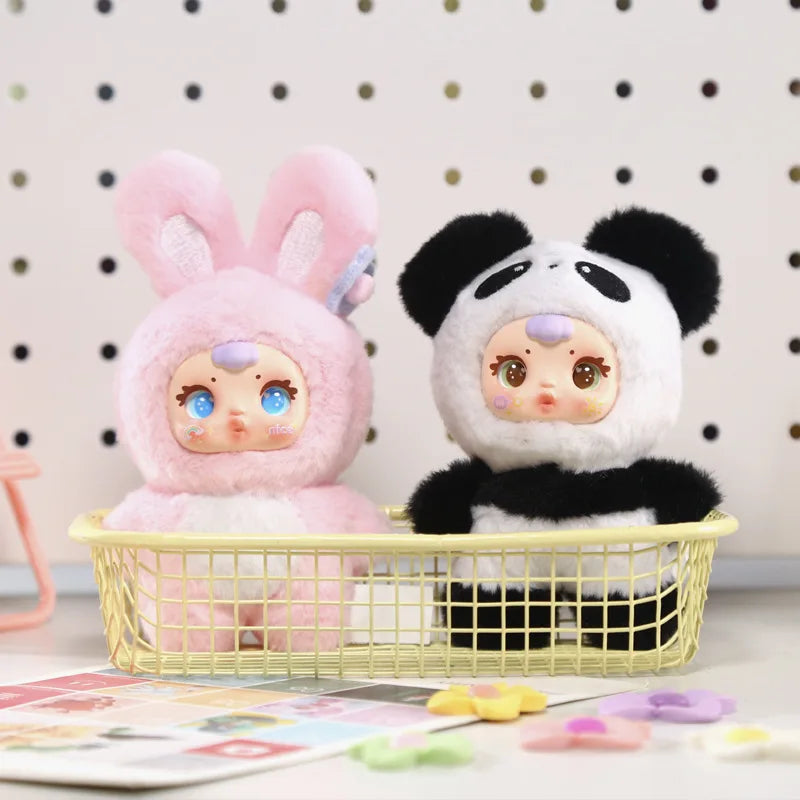 Two plush toys, one pink bunny and one panda, in a yellow basket against a polka dot wall.