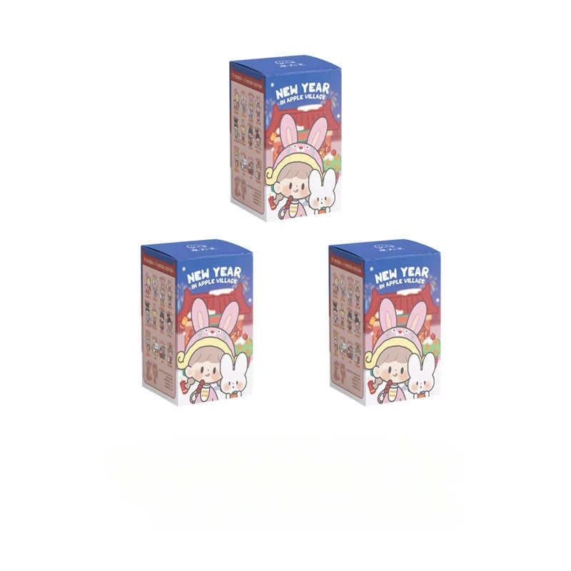Three boxes of 'New Year in Apple Village' with cartoon character on a white background