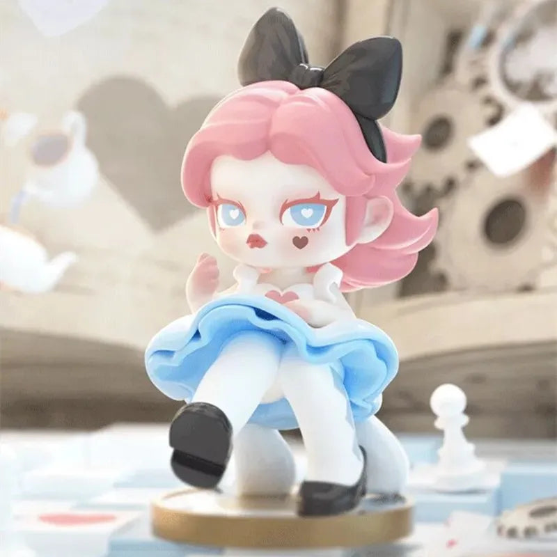Anime-style figurine with pink hair and a black bow, sitting on a surface.