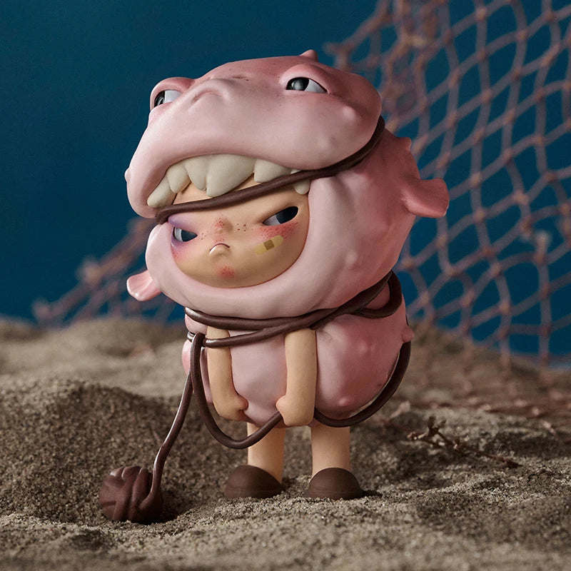 Pink cartoon-like creature with a rope around its neck on sandy ground