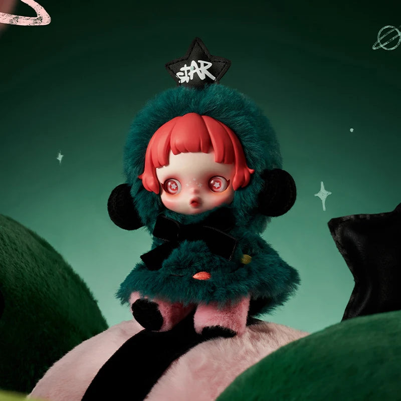 Toy figure with red hair and green fur coat on a dark green background