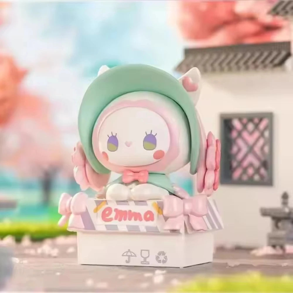 Colorful figurine with 'Emma' on a blurred background