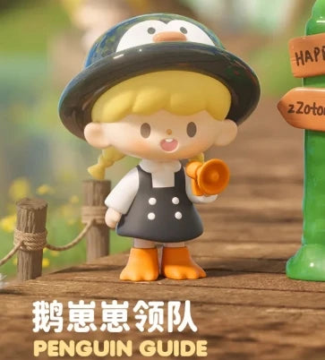 Toy figure of a penguin-like character with a hat and backpack, standing next to a signpost with text.