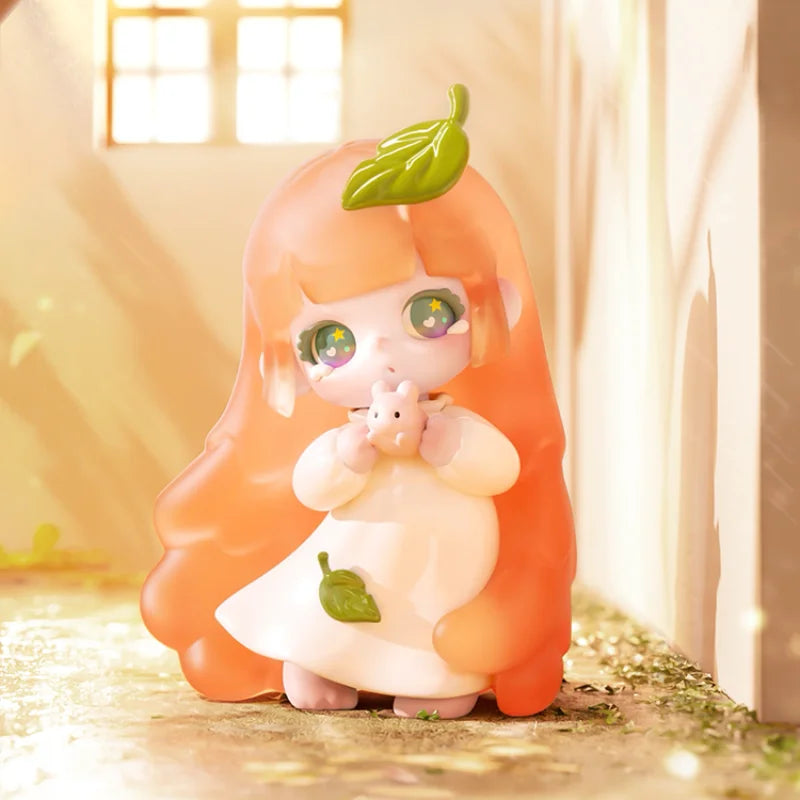 Anime-style figurine with long orange hair and green eyes, holding a small creature, in a warm-lit room.