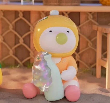 Toy figure with a yellow hat and pink shoes holding a colorful object on a wooden surface.