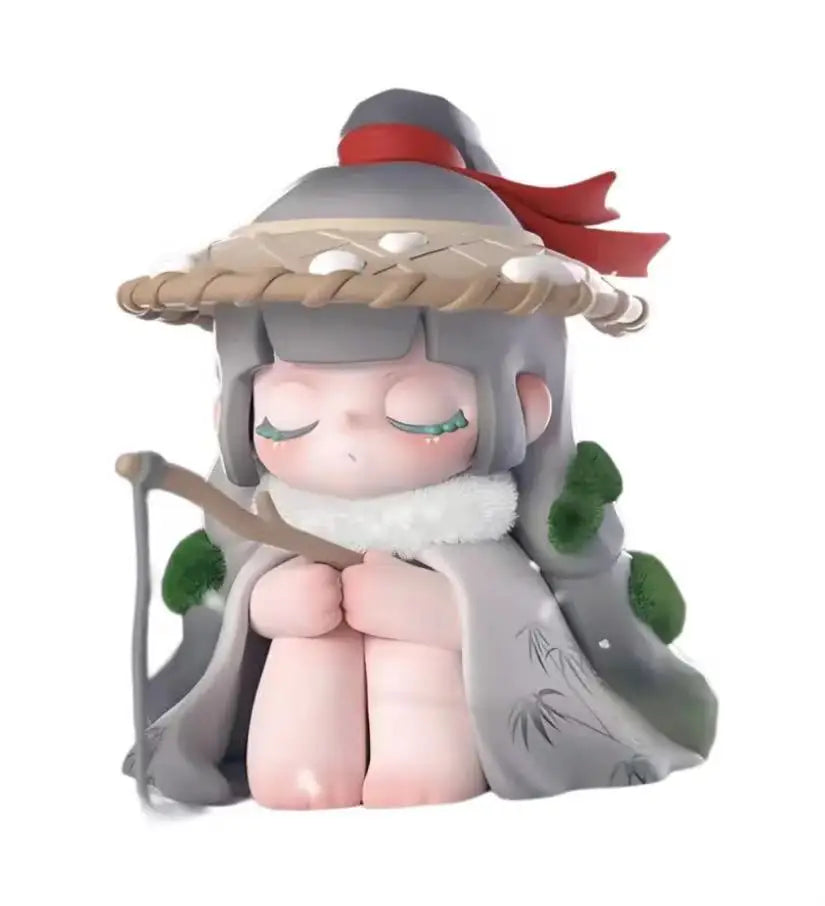 Animated character figurine with a large hat and staff on a white background