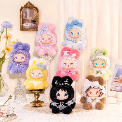 Collection of colorful plush toys with various designs on a decorative background