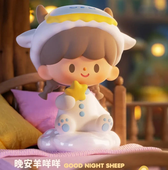 Toy figure of a sheep with a yellow hat and star, sitting on a bed with blurred background