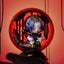 Decorative figurine with a red circular background