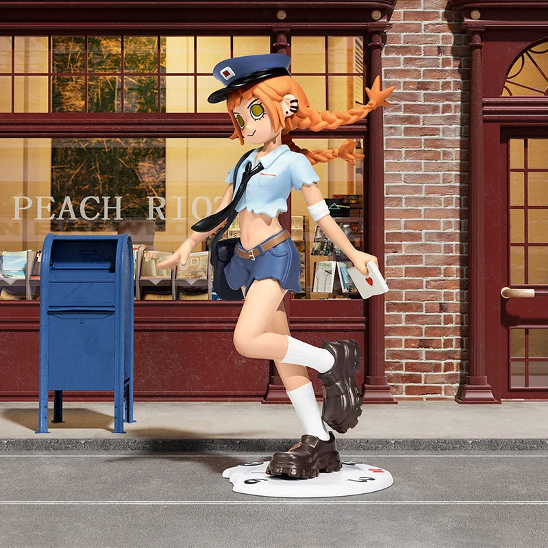 Figurine of a character in a school uniform standing next to a blue mailbox on a street.