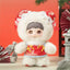 Plush toy with a white fur coat and red outfit against a red background