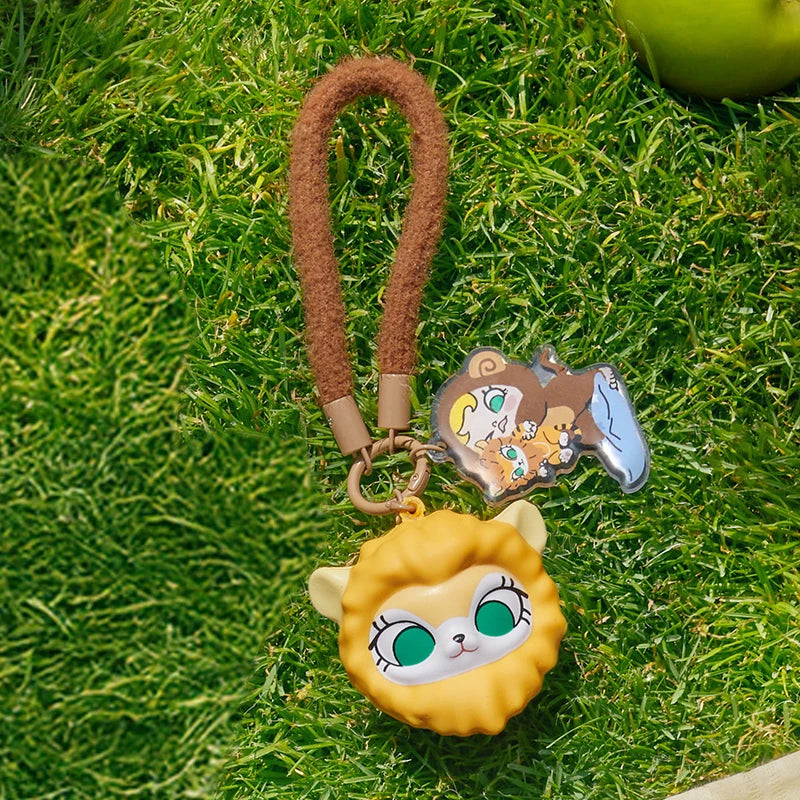 Keychain with cartoon character on grass