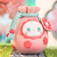 Cute plush toy with a floral design on a grassy background