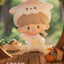 Cute plush toy resembling an alpaca with a blurred natural background